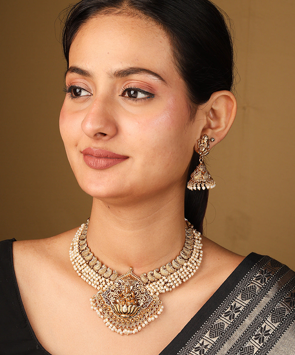White Bead Necklace with Gold Plated Lakshmi Motif Pendant