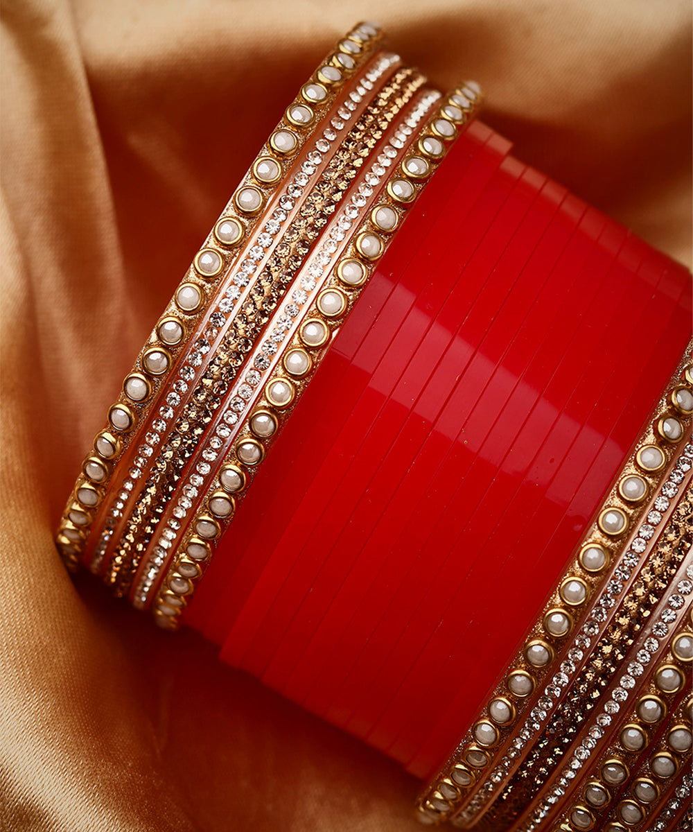 Set Of twenty-four Gold Plated Red AD Stone Studded Chuda Set