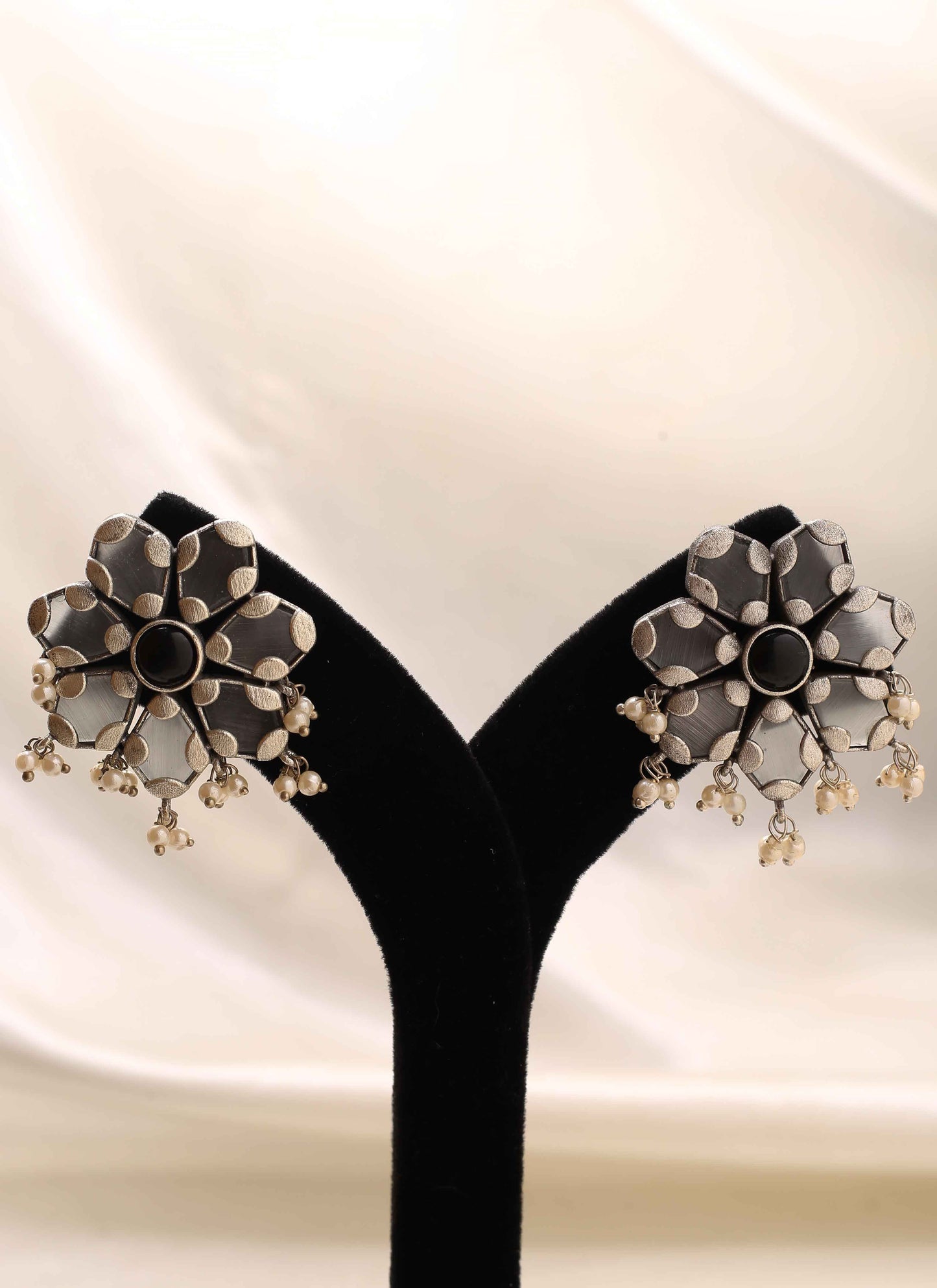 White Floral Shaped Earrings With Black Stone