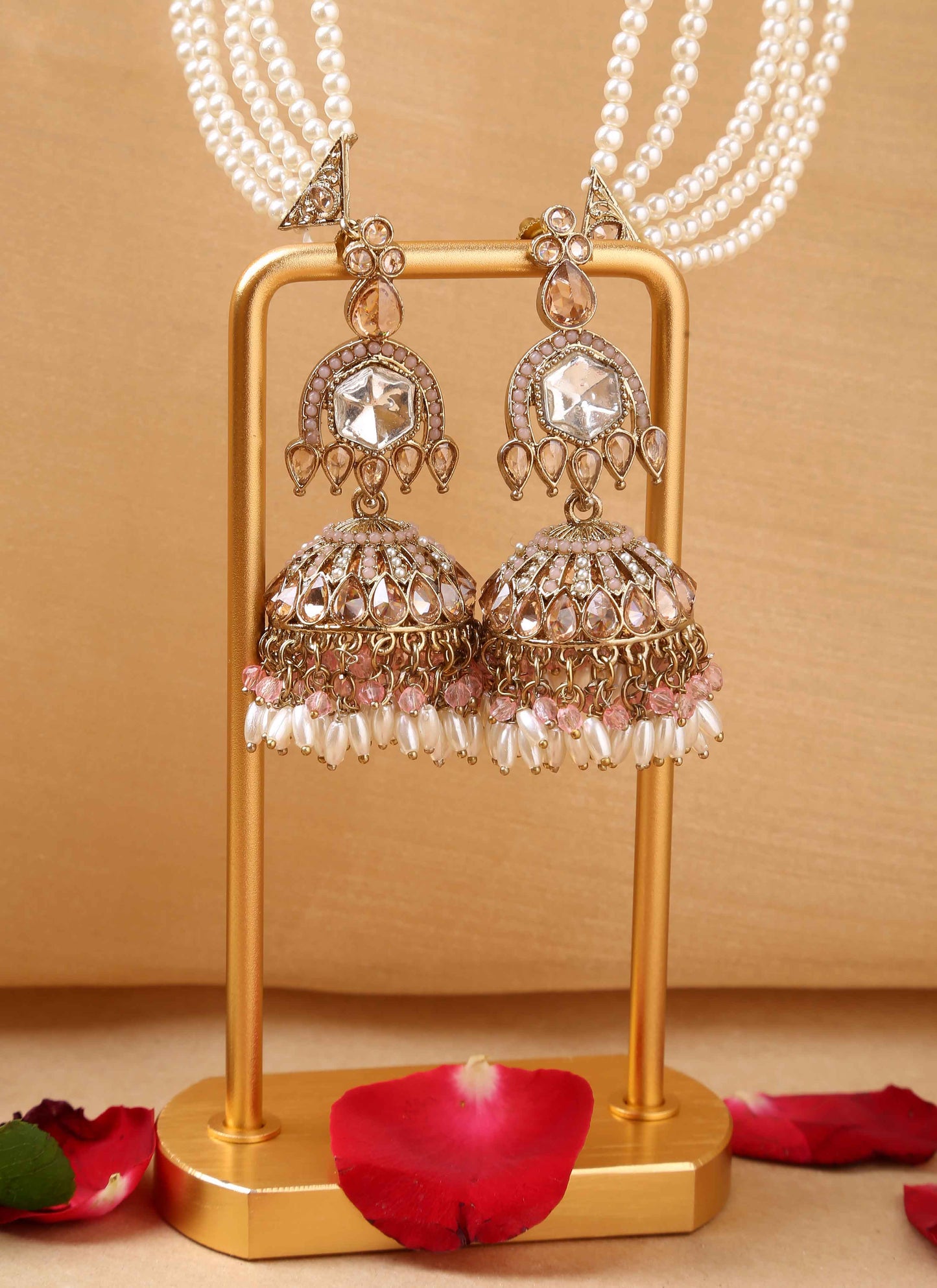 American diamond jhumkas with pearl ear chain and pink accents