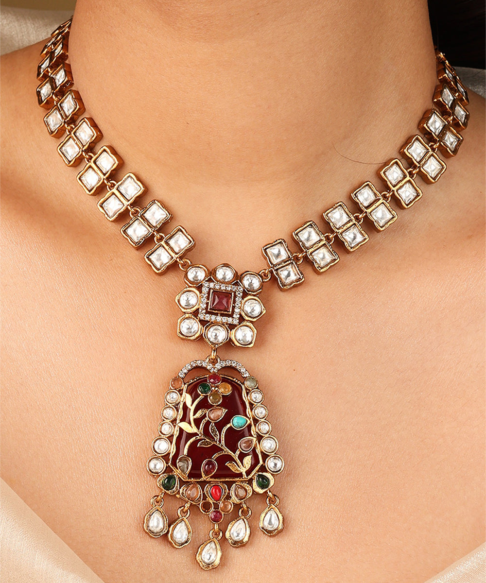 Gold Carved Necklace Set with Red Stones and White Kundan