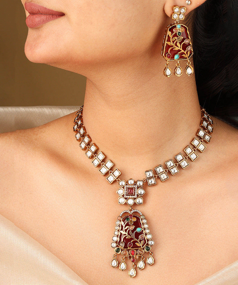 Gold Carved Necklace Set with Red Stones and White Kundan
