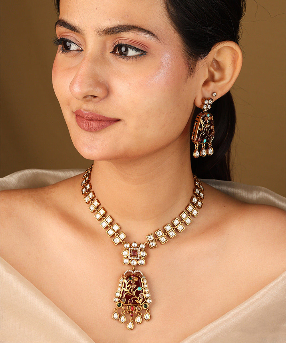 Gold Carved Necklace Set with Red Stones and White Kundan