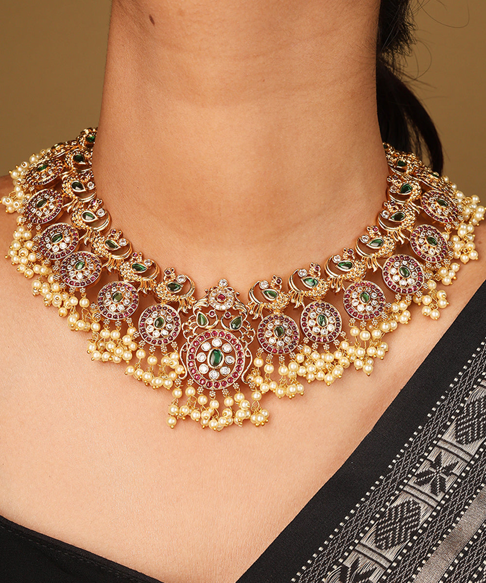 Gold Plated Guttapusalu Necklace with Red Stone Accents Jhumkis and Pearl Pendant