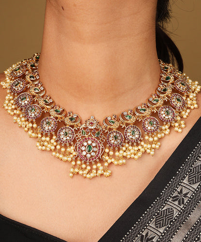 Gold Plated Guttapusalu Necklace with Red Stone Accents Jhumkis and Pearl Pendant