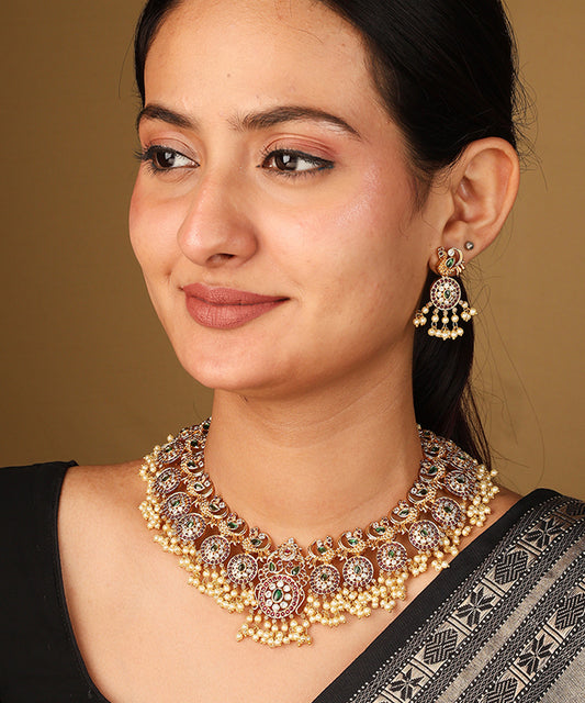Gold Plated Guttapusalu Necklace with Red Stone Accents Jhumkis and Pearl Pendant