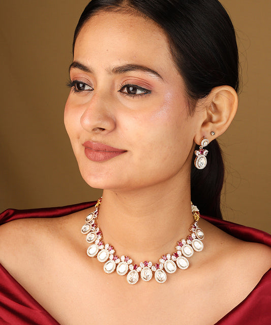 Raindrop Shaped Transparent Stone Necklace with Red Accents and Matching Earrings