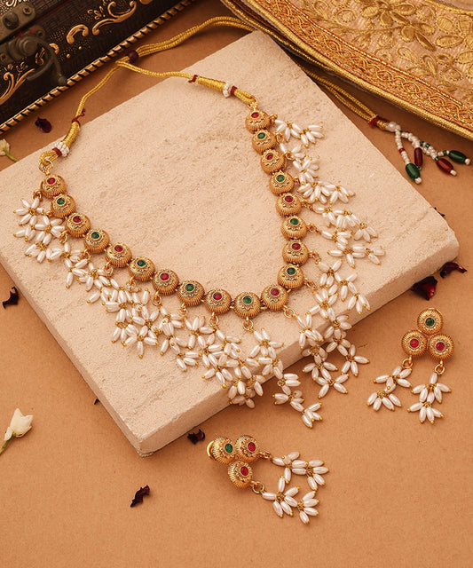 Gold Cup Necklace with Red Stones and White Oval Jhumkis