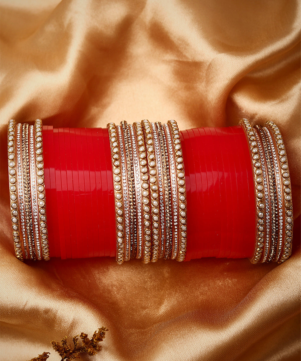Set Of twenty-four Gold Plated Red AD Stone Studded Chuda Set
