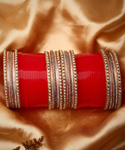 Set Of twenty-four Gold Plated Red AD Stone Studded Chuda Set