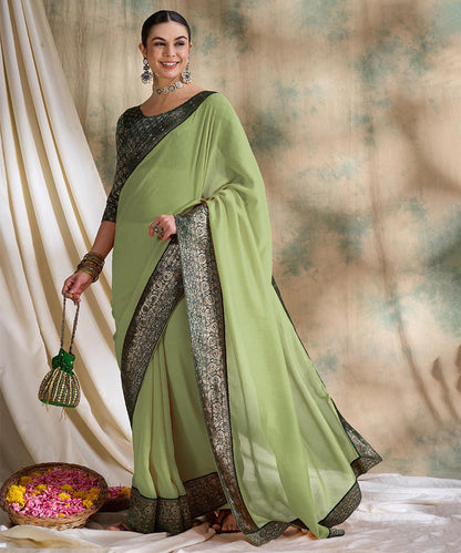 Light Green Saree with Zari Woven Border and Dark Green Blouse