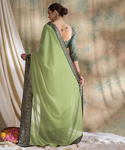 Light Green Saree with Zari Woven Border and Dark Green Blouse