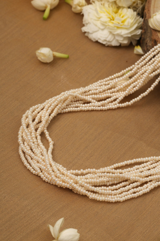 White Pearl Necklace with Small Bead Accents