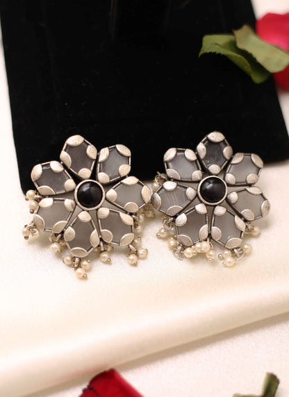 White Floral Shaped Earrings With Black Stone