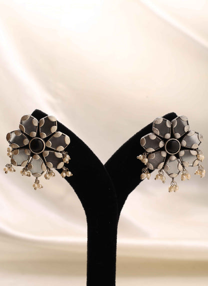 White Floral Shaped Earrings With Black Stone