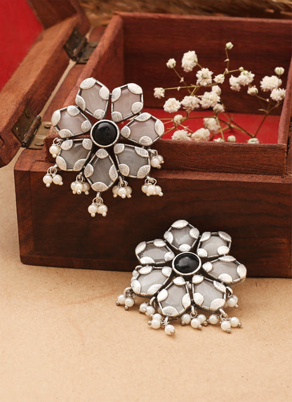 White Floral Shaped Earrings With Black Stone