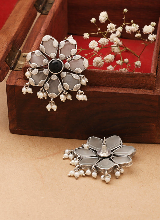 White Floral Shaped Earrings With Black Stone