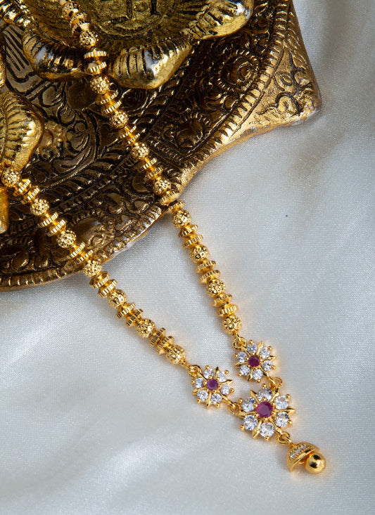 Gold Plated Ball Beaded Necklace with American Diamond Pendant