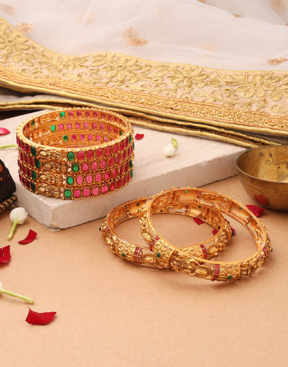 Goddess Radiance: Broad Gold-Plated Bangle with Intricate Motif and Gemstone Accents