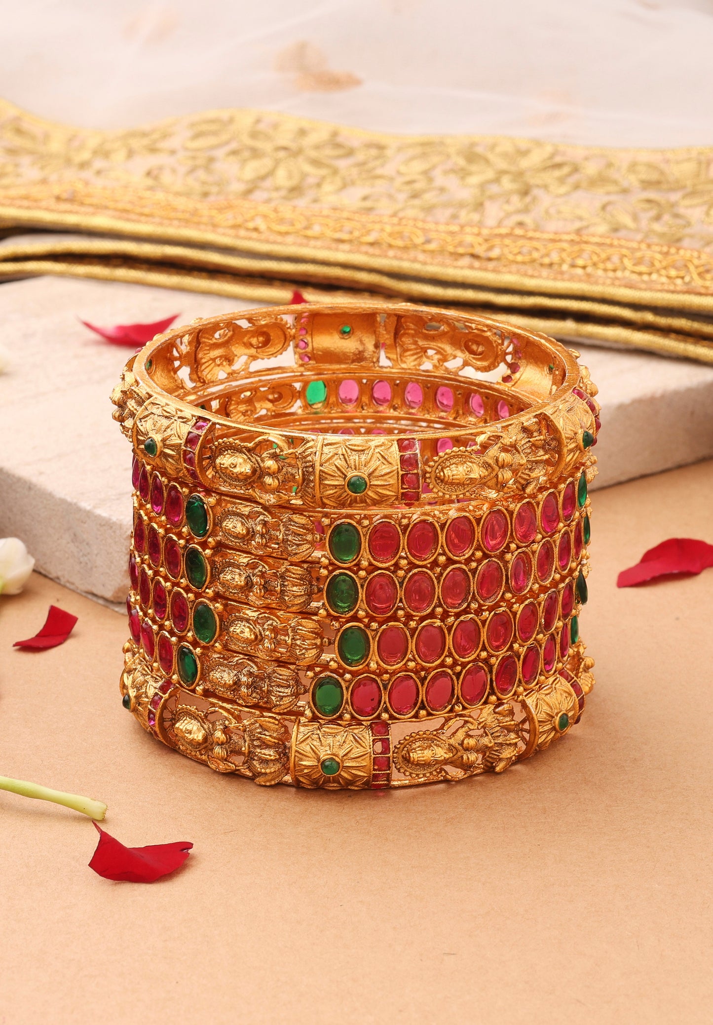 Goddess Radiance: Broad Gold-Plated Bangle with Intricate Motif and Gemstone Accents