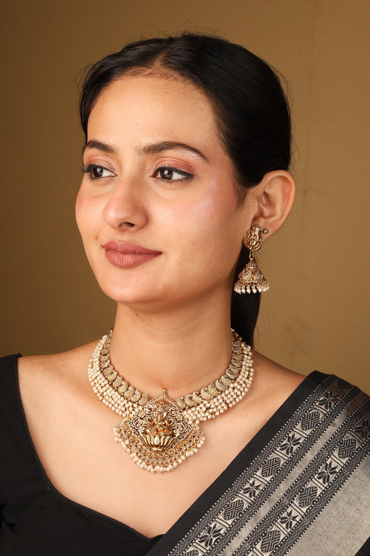 Elegant White Bead Necklace with Gold Plated Lakshmi Motif Pendant