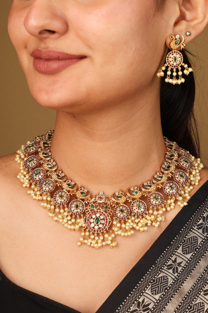 Gold Plated Guttapusalu Necklace with Red Stone Accents Jhumkis and Pearl Pendant