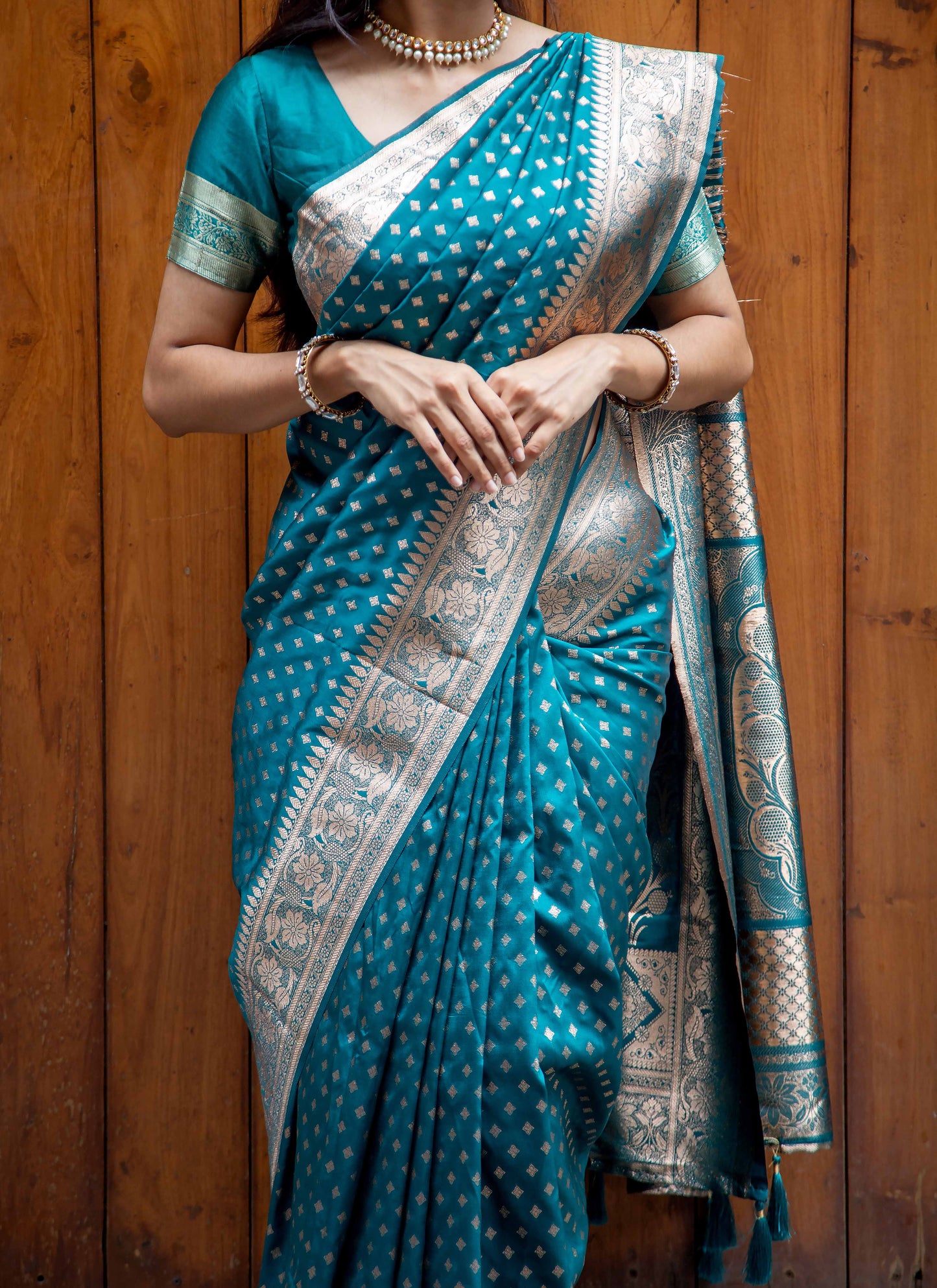 Teal Green Zari Woven Saree with Floral Border and Tassels