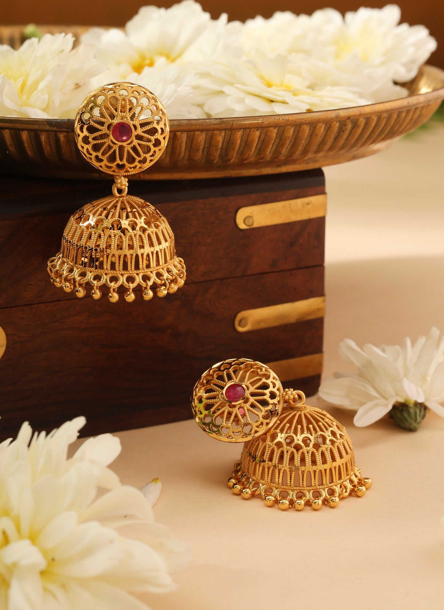 Gold Jhumkas with Pink Stone Accent