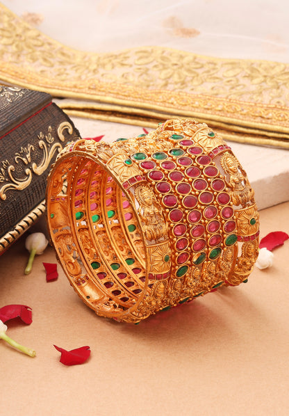 Goddess Radiance: Broad Gold-Plated Bangle with Intricate Motif and Gemstone Accents