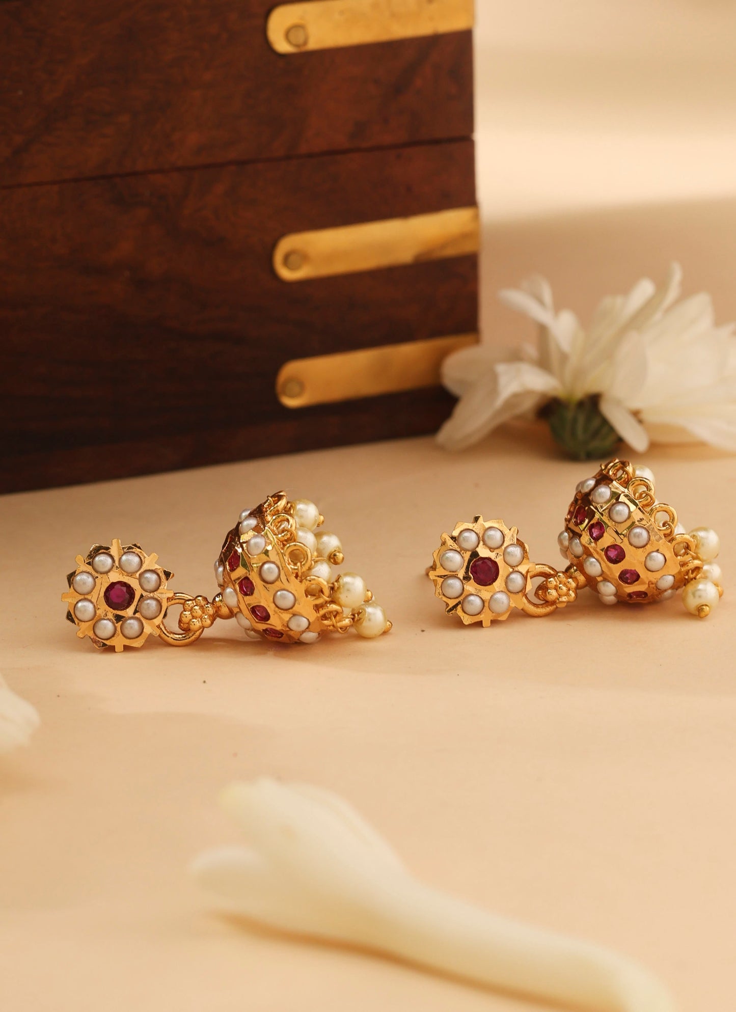 Gold Jhumkas with Pink and White Stone Accents