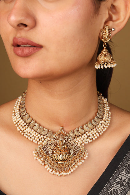 Elegant White Bead Necklace with Gold Plated Lakshmi Motif Pendant