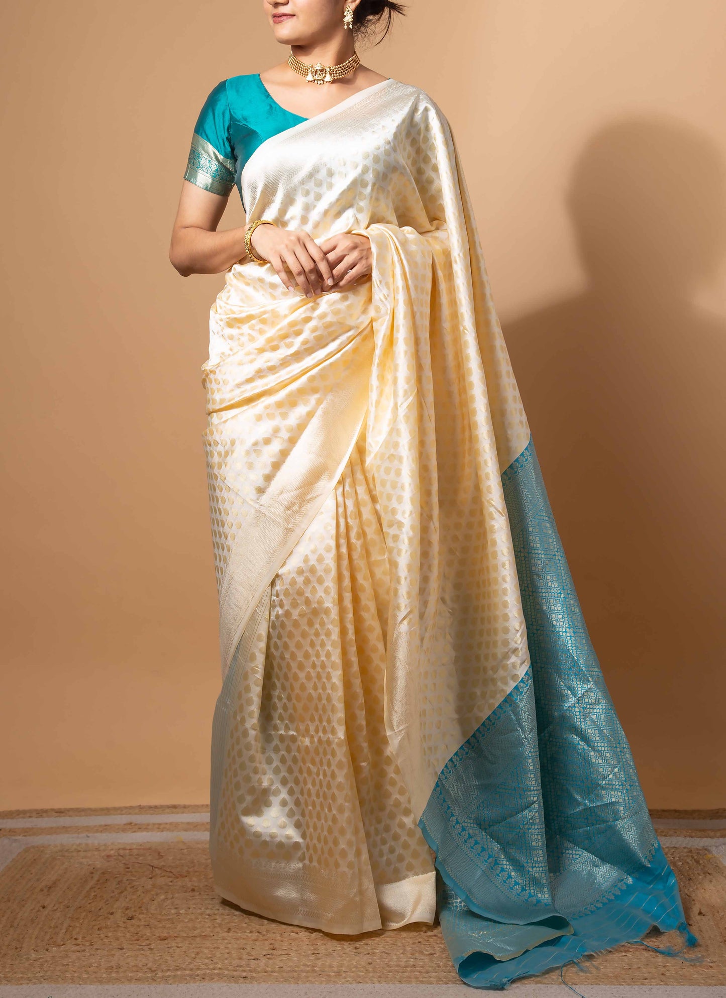 Ivory and Teal Zari Woven Saree with Intricate Motifs