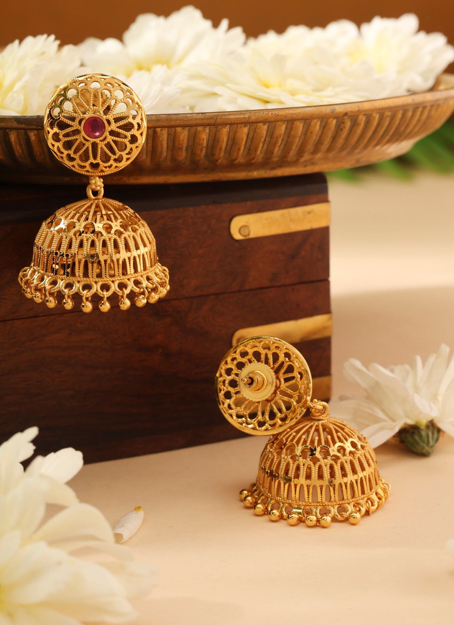 Gold Jhumkas with Pink Stone Accent