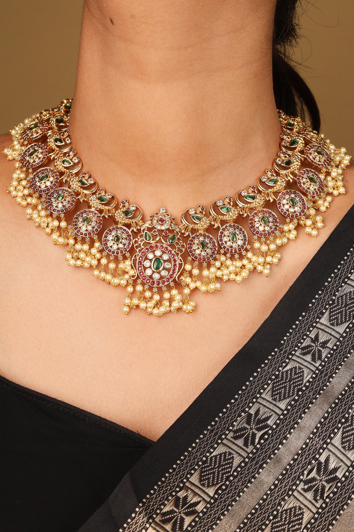 Gold Plated Guttapusalu Necklace with Red Stone Accents Jhumkis and Pearl Pendant