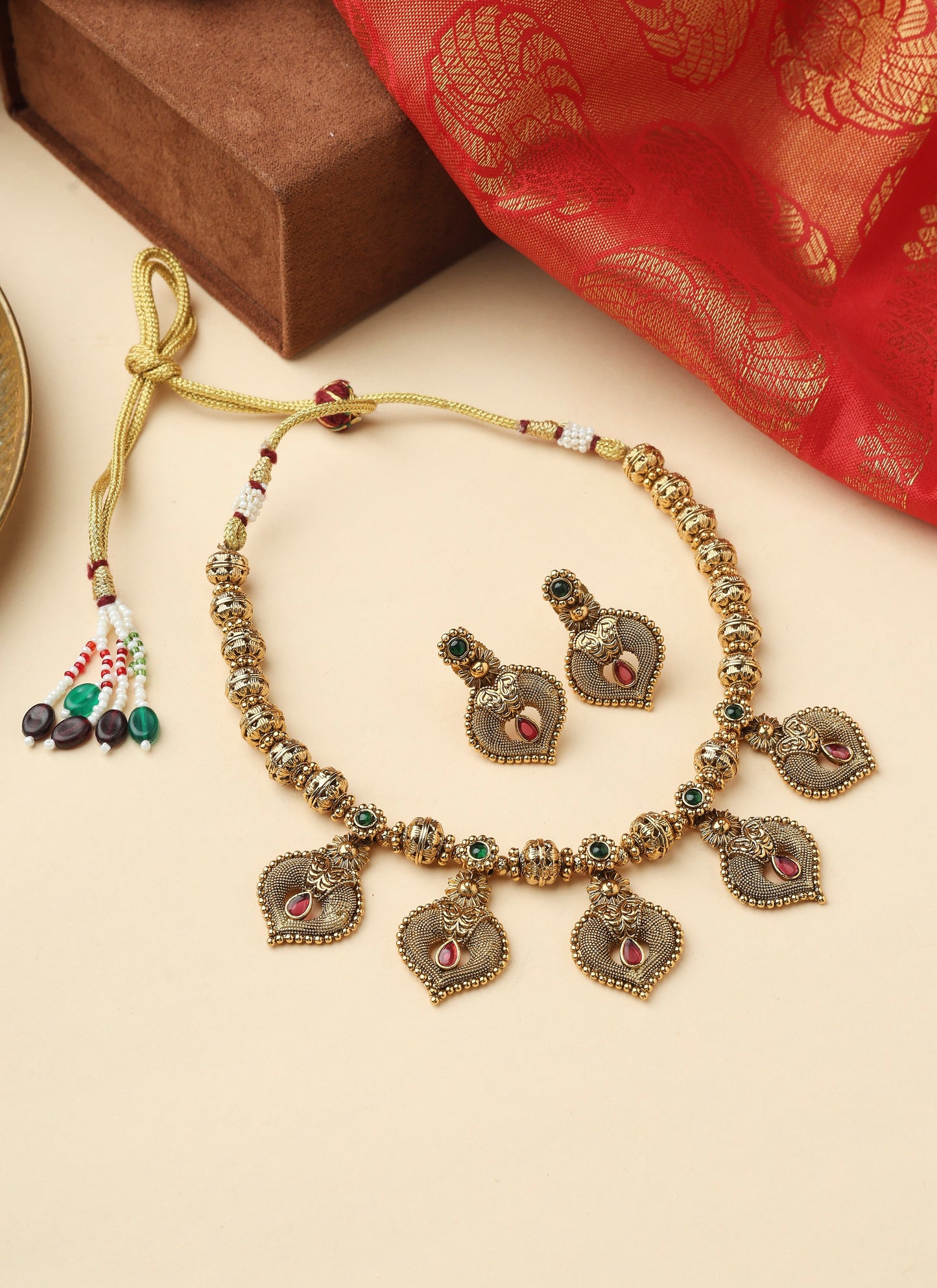 High Gold Necklace with Gold Motifs Matching Earrings and Stone Accents