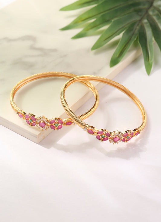 Set of two Gold Bangles with Pink Stone Center Detailing