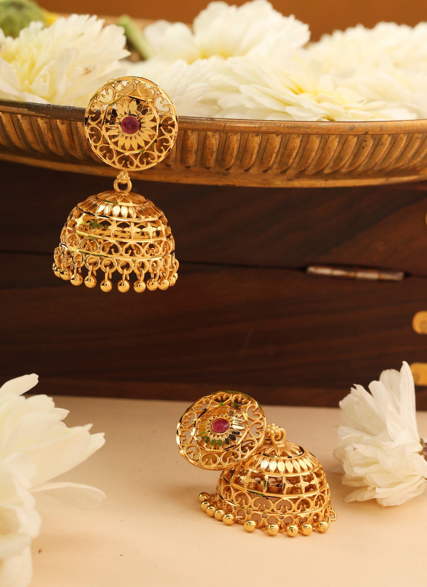 Gold Jhumkas with Intricate Detailing