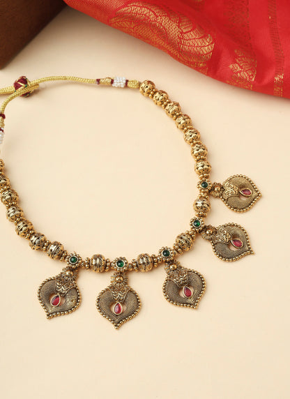 High Gold Necklace with Gold Motifs Matching Earrings and Stone Accents