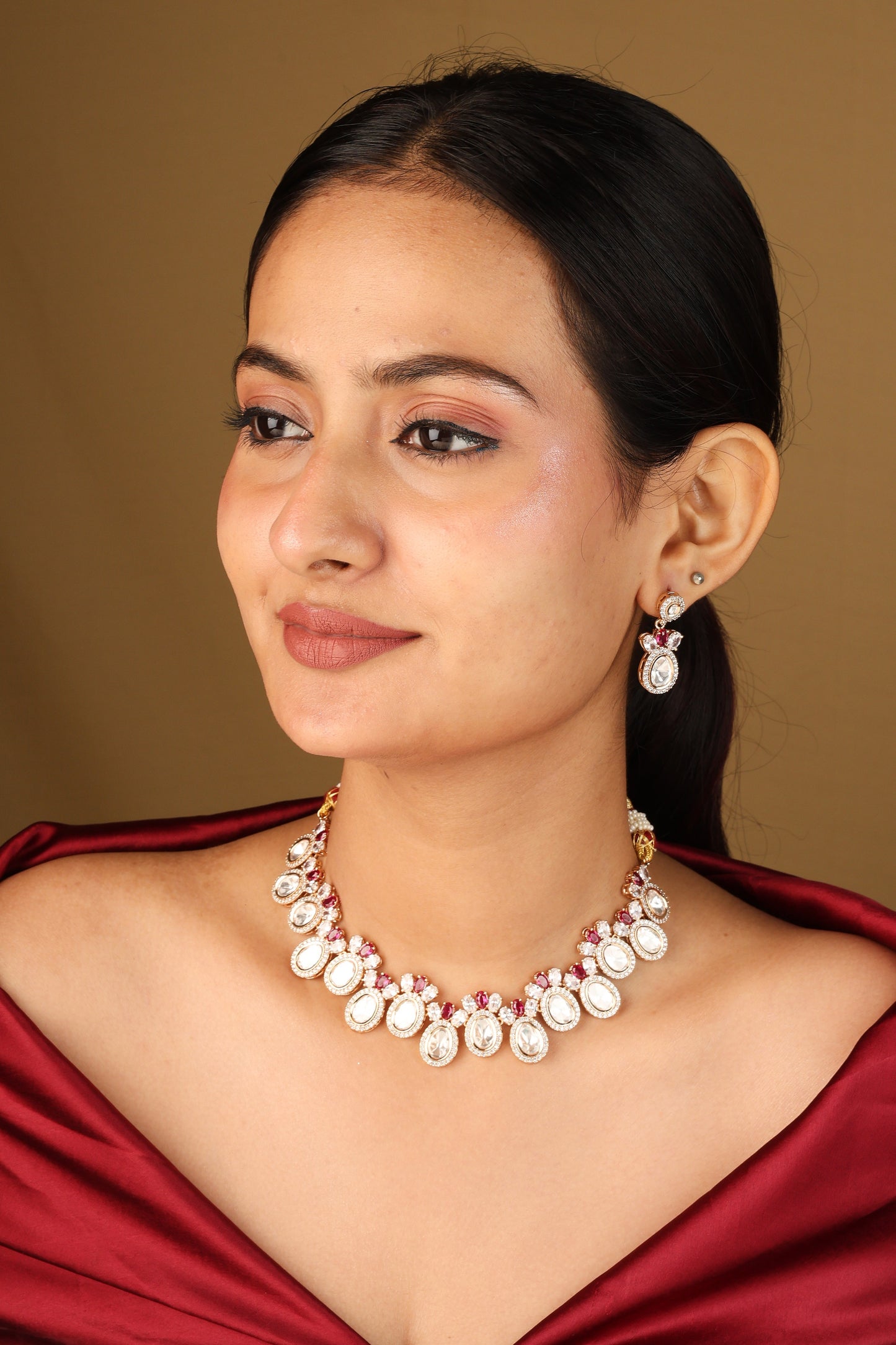 Raindrop Shaped Transparent Stone Necklace with Red Accents and Matching Earrings