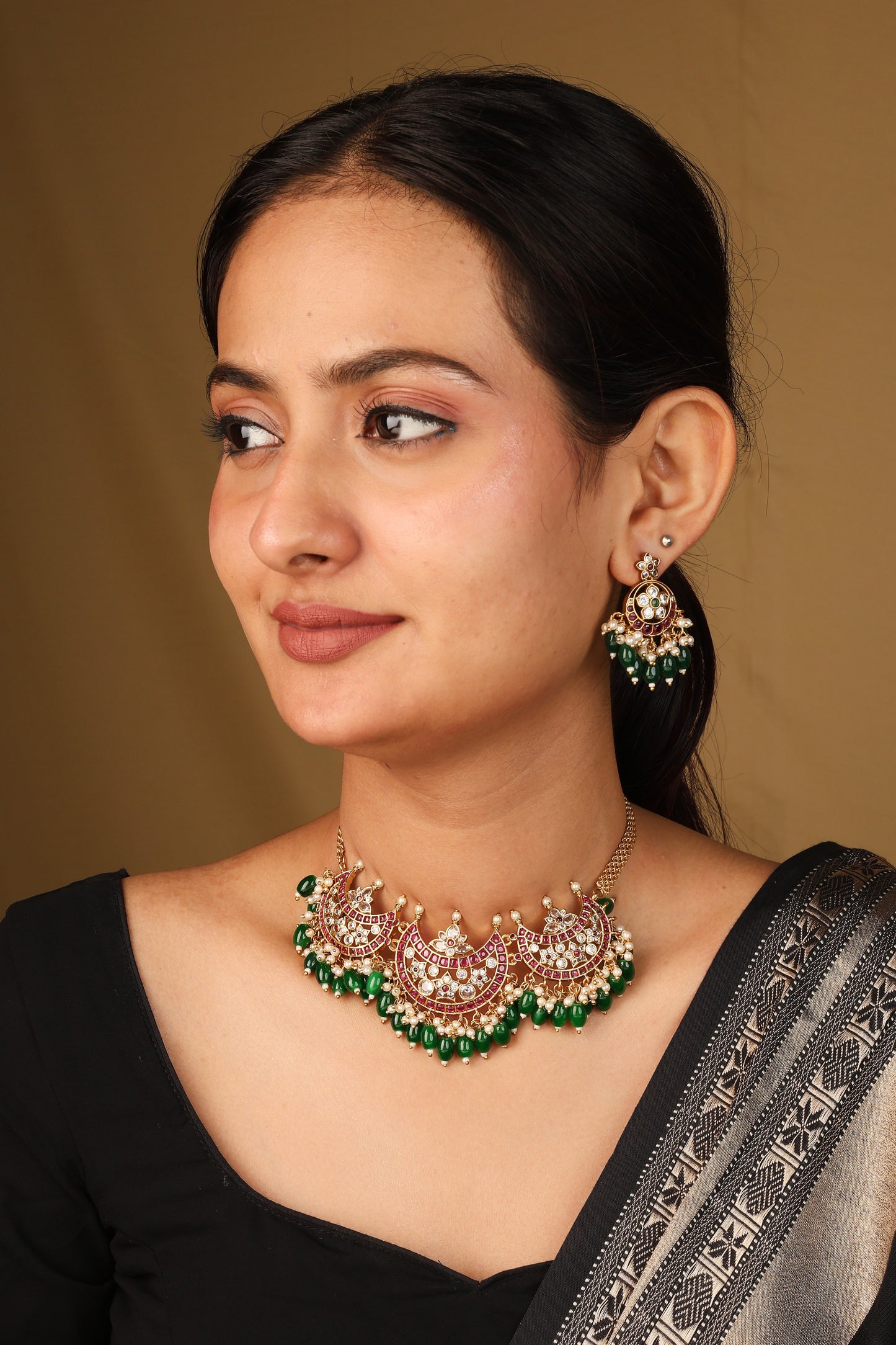 Moon Shaped Pendant Necklace with Dark Green Jhumkis and Matching Earrings